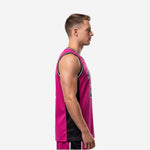 Front view of custom pink basketball jersey with white-trimmed black V-neck collar, arched team name across chest, and large block number below on hot-pink body