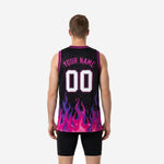 Right side view of custom pink basketball jersey showing pink-to-purple flame gradient wrapping the lower panel and sleeveless athletic cut
