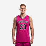 Custom pink basketball jerseys with black side panels, V-neck binding, arched team name and number 23 on front, shown front and back on adult male model