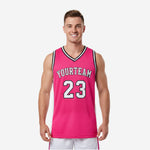 Custom pink basketball jerseys with black and white V-neck trim, white side panels, arched team name and number 23 on the front, back view also shown