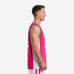 Front view of custom pink basketball jersey featuring hot pink mesh body, black-white-black bound V-neck, and white printed team name and number