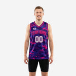 Custom pink basketball jerseys in purple and pink full-body camo pattern with arced team name and front number, front and back view