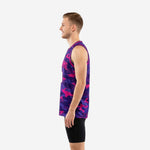 Side view of custom pink basketball jersey in purple and pink camo showing straight hem, side vents, and wide armhole binding