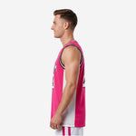 Left side view of custom pink basketball jersey showing white sublimated side panel running from armhole to hem on hot pink mesh body