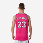 Right side view of custom pink basketball jersey displaying the contrast between hot pink front panel and white side panel with bound armhole edge
