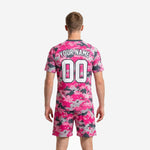Custom pink camo soccer jersey back view showing player name and number print zones on hot pink digital camo sublimated kit