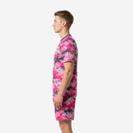 Pink digital camo soccer kit right side view showing full-dye sublimation print from shoulder to shorts hem on male model