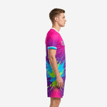 Custom pink soccer uniforms side view showing hot pink to purple gradient and cyan sleeve trim on matching shorts