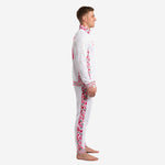 Custom pink soccer tracksuit showing hot pink floral side stripe on pants and sleeve panel, left side view
