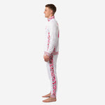 Custom pink soccer tracksuit right side view showing tapered pants with floral side stripe and ribbed ankle cuffs