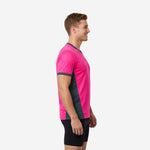 Pink soccer training jersey with charcoal contrast side panels, left side view showing athletic taper
