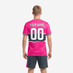 Hot pink custom soccer uniform front detail showing glitch stripe print across charcoal chest band and white team name