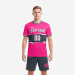 Custom pink soccer uniforms in hot pink and charcoal with white trim crew neck, front view on male model