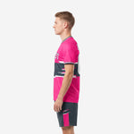 Custom pink soccer uniform kit right side view showing hot pink jersey lower body and charcoal shorts with pink side stripe