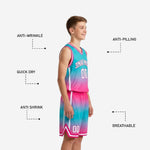 Back view of custom pink youth basketball uniforms showing back number placement on teal-to-pink gradient sublimated jersey