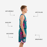 Opposite side view of custom pink youth basketball uniform set highlighting the pink and white armhole binding and fragmented triangle graphic detail