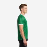 Custom pinstripe soccer training jersey in Kelly Green and White showing side profile and white sleeve cuff trim on male model