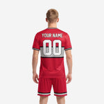 Custom soccer jersey in Crimson Red with black and white dot-burst panel and white team name print on chest