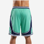 Back view of custom printed green and white basketball shorts with sublimated player number and navy V-hem detail