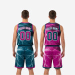 Full set view of custom printed reversible basketball uniforms in teal and magenta laid flat showing both the teal and magenta sides