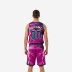 Custom printed reversible basketball uniforms teal side panel view showing full lightning sublimation across the jersey and shorts side panels