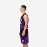 Side view of custom purple and black basketball uniforms showing unbroken gradient print across jersey torso and matching shorts leg