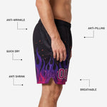 Detail close-up of purple to magenta flame gradient and ember scatter print on custom sublimated basketball shorts