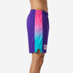 Side view of custom purple basketball shorts showing full-length pink-to-teal gradient panel and hem split detail