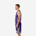 Opposite side view of purple sublimated basketball uniform set showing geometric jersey side panel and matching shorts construction