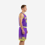 Custom purple basketball uniform side view showing neon yellow V-neck binding, armhole trim, and halftone dot shorts fade detail