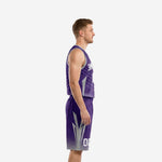 Side view of custom purple and silver basketball uniform showing silver arrow shorts panel and V-neck jersey binding detail