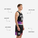 Close detail of black basketball uniform shorts with red-coral to purple pixel-burst gradient and player number on right leg