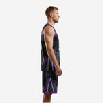Side view of custom purple and black sublimated basketball uniform set showing purple piping and armhole binding detail