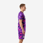 Custom purple soccer uniforms side view showing digital camo pattern across jersey and shorts on male model