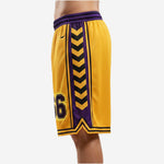 Side profile of gold basketball shorts with purple chevron side panel and double black stripe hem detail