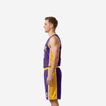 Opposite side view of custom purple and gold basketball uniform showing gold side panel continuity from jersey hem into shorts waistband
