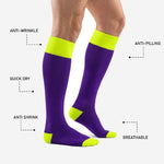Reinforced neon yellow heel pad and toe box on custom purple and gold soccer socks for matchday wear