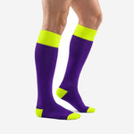 Custom purple and gold soccer socks showing solid royal purple calf panel and neon yellow cuff, side angle