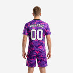 Custom purple soccer kit jersey detail showing digital camo sublimation print and white team name lettering