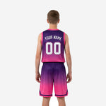 Back view of custom purple youth basketball uniforms with pink gradient, back number and player name print zones