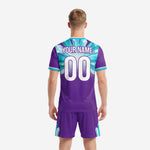 Detail of custom sublimated purple and teal soccer kit showing crystal burst graphic across chest