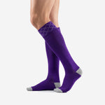 Custom purple soccer socks angled view displaying knee-high length and ribbed calf construction