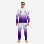 Custom purple soccer tracksuit with Royal Purple to White gradient, stand collar full-zip jacket and tapered pants, front view on male model