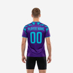 Close detail of turquoise geometric faceted shard panels on custom purple soccer training jersey shoulders