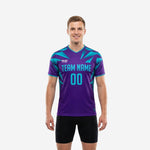 Custom purple soccer training jersey with turquoise geometric shard print, team name and number on chest, front view on male model