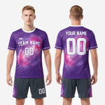 Full custom purple and pink galaxy soccer uniform set laid flat showing jersey and matching shorts