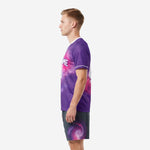 Custom purple and pink sublimated soccer uniform set, right side view showing full jersey and charcoal galaxy shorts