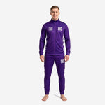 Men's custom purple and white soccer tracksuit front view showing team logo and number 00 on royal purple full-zip jacket and tapered track pants