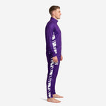 Custom purple and white soccer tracksuit left side view showing white brush-stroke sublimated side panel running from jacket underarm to pant ankle