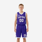 Custom purple youth basketball uniforms two-piece set with white V-neck binding, arced team name on chest, and front number 00 on solid purple jersey and matching shorts